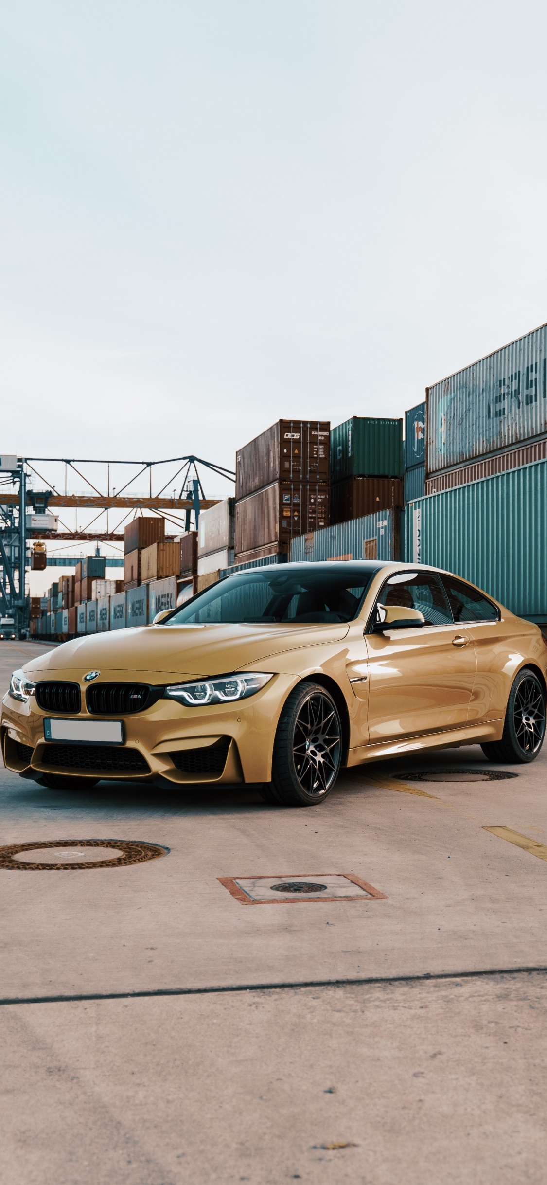 Yellow Porsche 911 Parked on Road Near Building During Daytime. Wallpaper in 1125x2436 Resolution