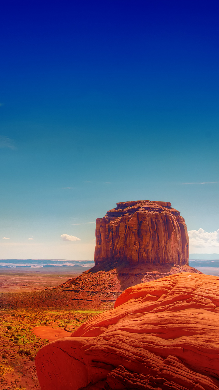 Brown Rock Formation Near Body of Water During Daytime. Wallpaper in 750x1334 Resolution