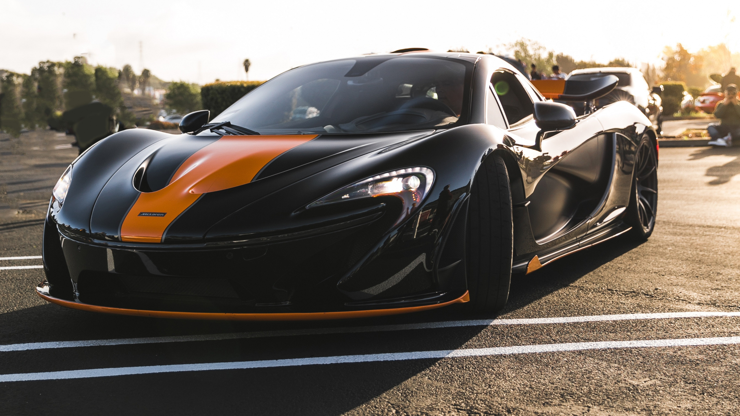 Black and Orange Sports Car on Road During Daytime. Wallpaper in 2560x1440 Resolution