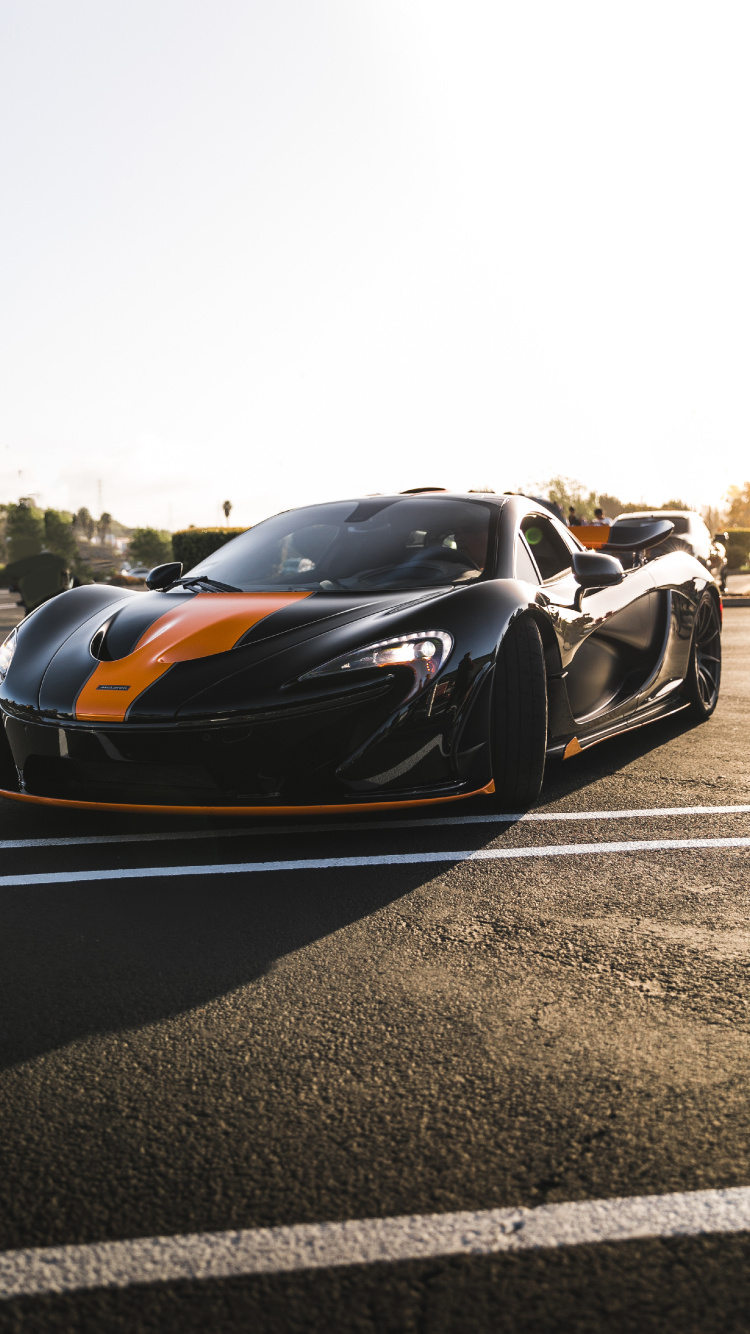 Black and Orange Sports Car on Road During Daytime. Wallpaper in 750x1334 Resolution