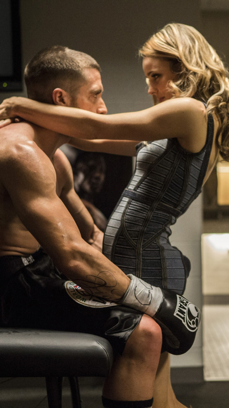 Man in Black Shorts and Woman in Black Tank Top Kissing. Wallpaper in 750x1334 Resolution