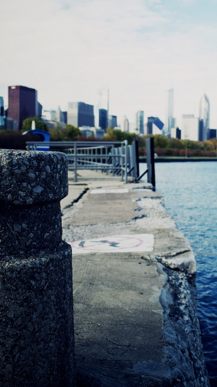 Body of Water Near City Buildings During Daytime. Wallpaper in 750x1334 Resolution