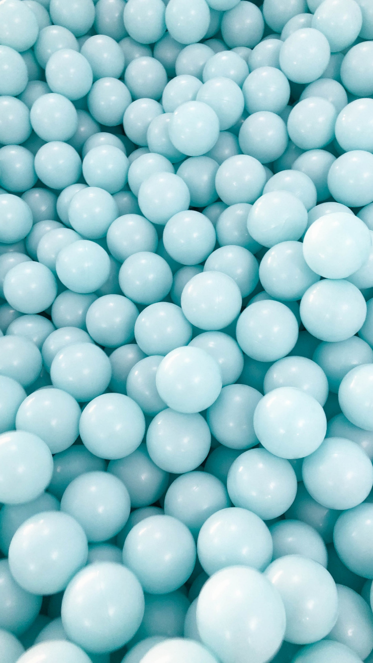 Green Round Beads on White Plastic Container. Wallpaper in 750x1334 Resolution