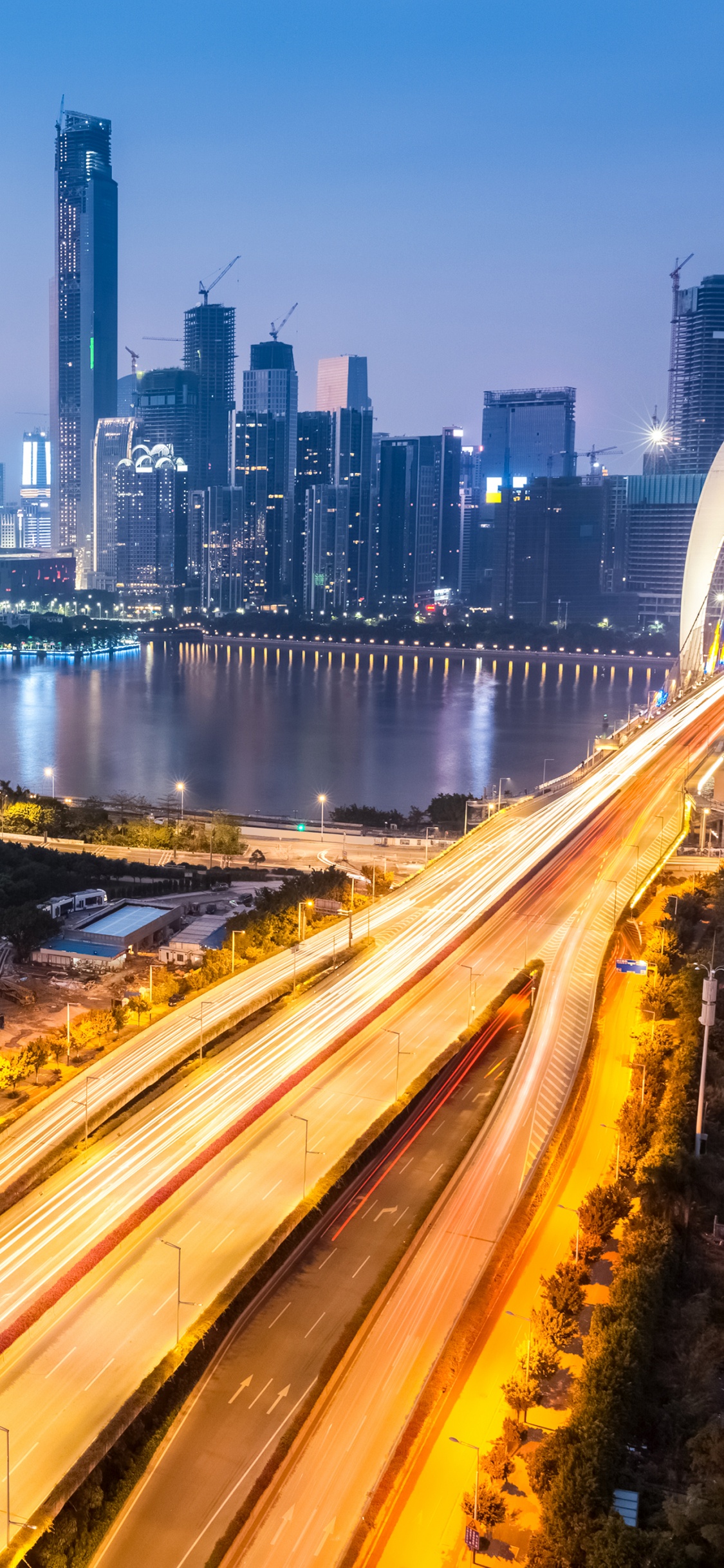 Time Lapse Photography of City Skyline During Night Time. Wallpaper in 1125x2436 Resolution