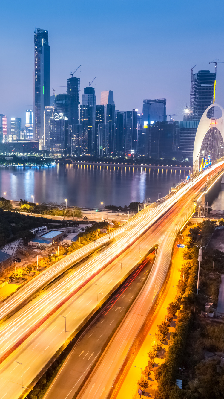 Time Lapse Photography of City Skyline During Night Time. Wallpaper in 750x1334 Resolution