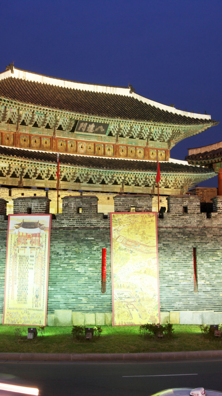 White and Brown Concrete Building Near Body of Water During Daytime. Wallpaper in 750x1334 Resolution