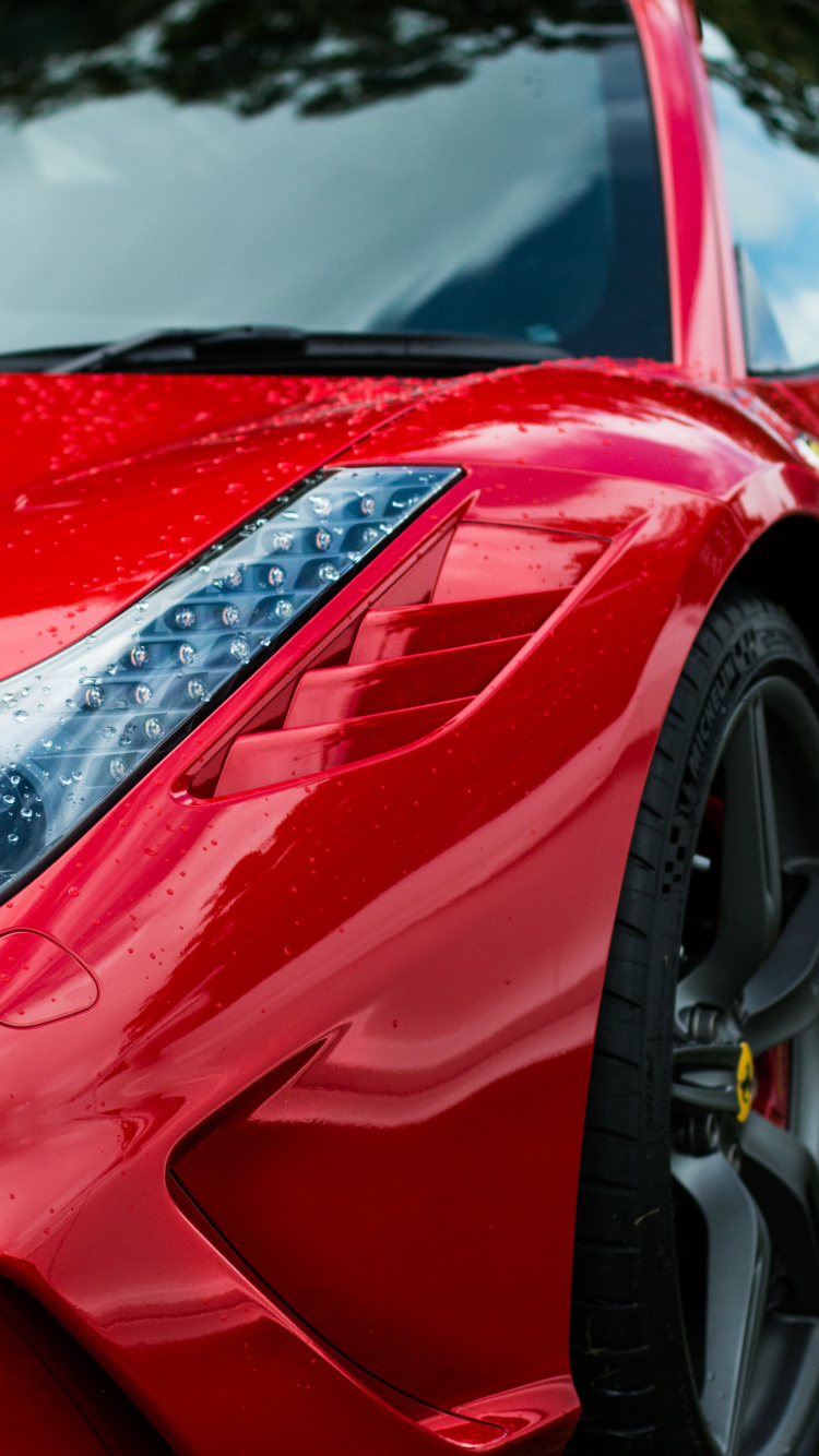 Rotes Ferrari-auto Auf Grüner Wiese Tagsüber. Wallpaper in 750x1334 Resolution