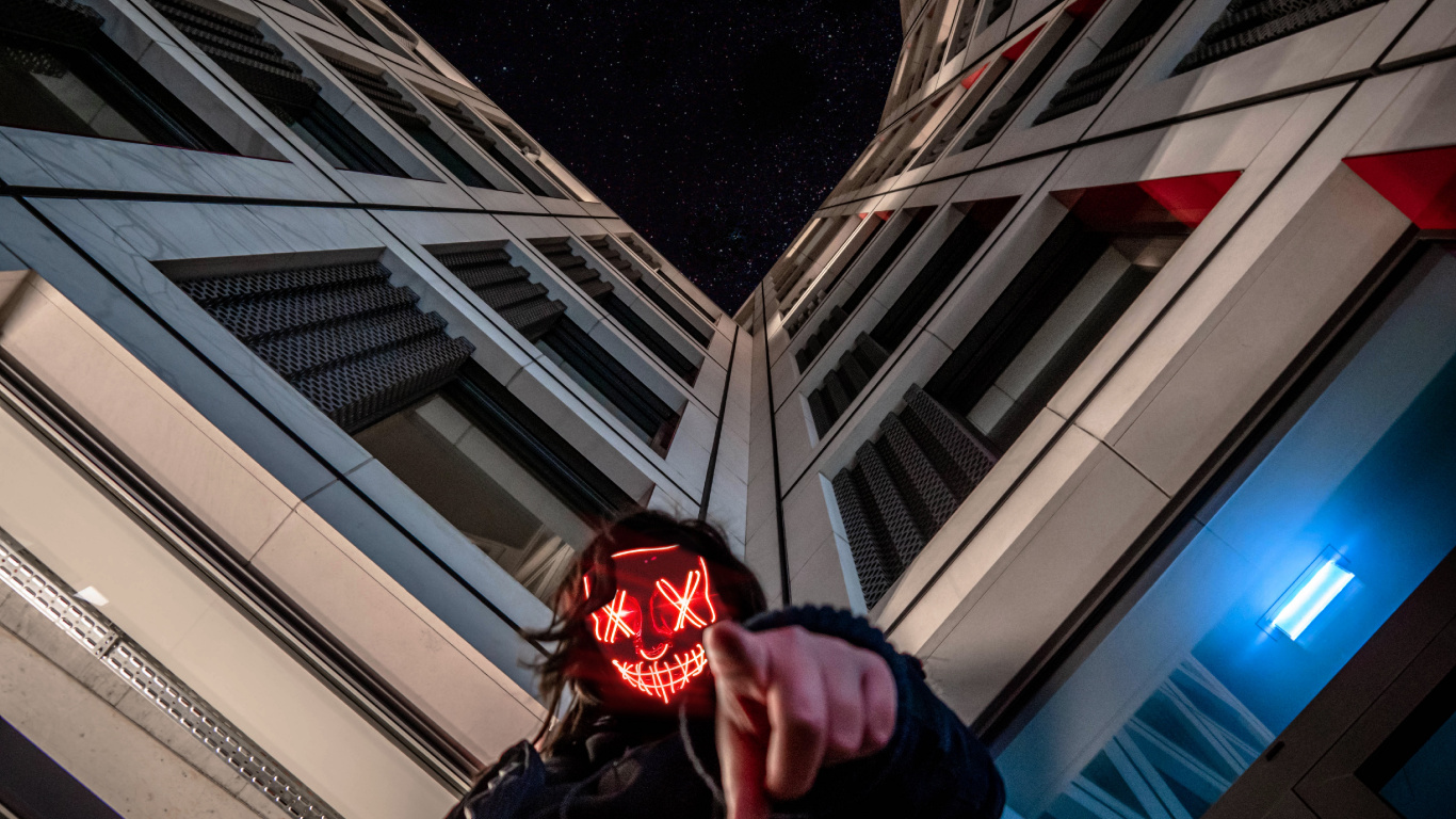 Person in Black Jacket Holding Red Ball. Wallpaper in 1366x768 Resolution