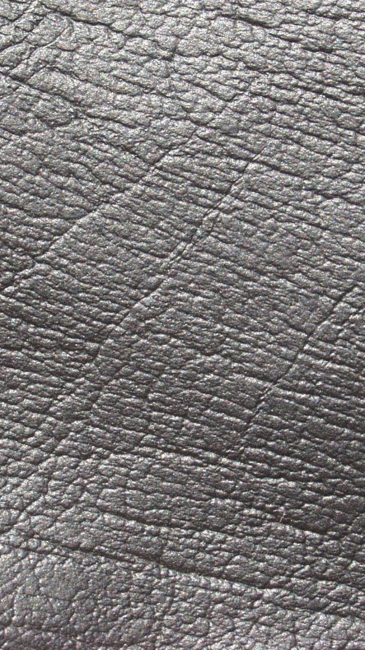 Schwarzes Ledertextil in Nahaufnahmen. Wallpaper in 750x1334 Resolution