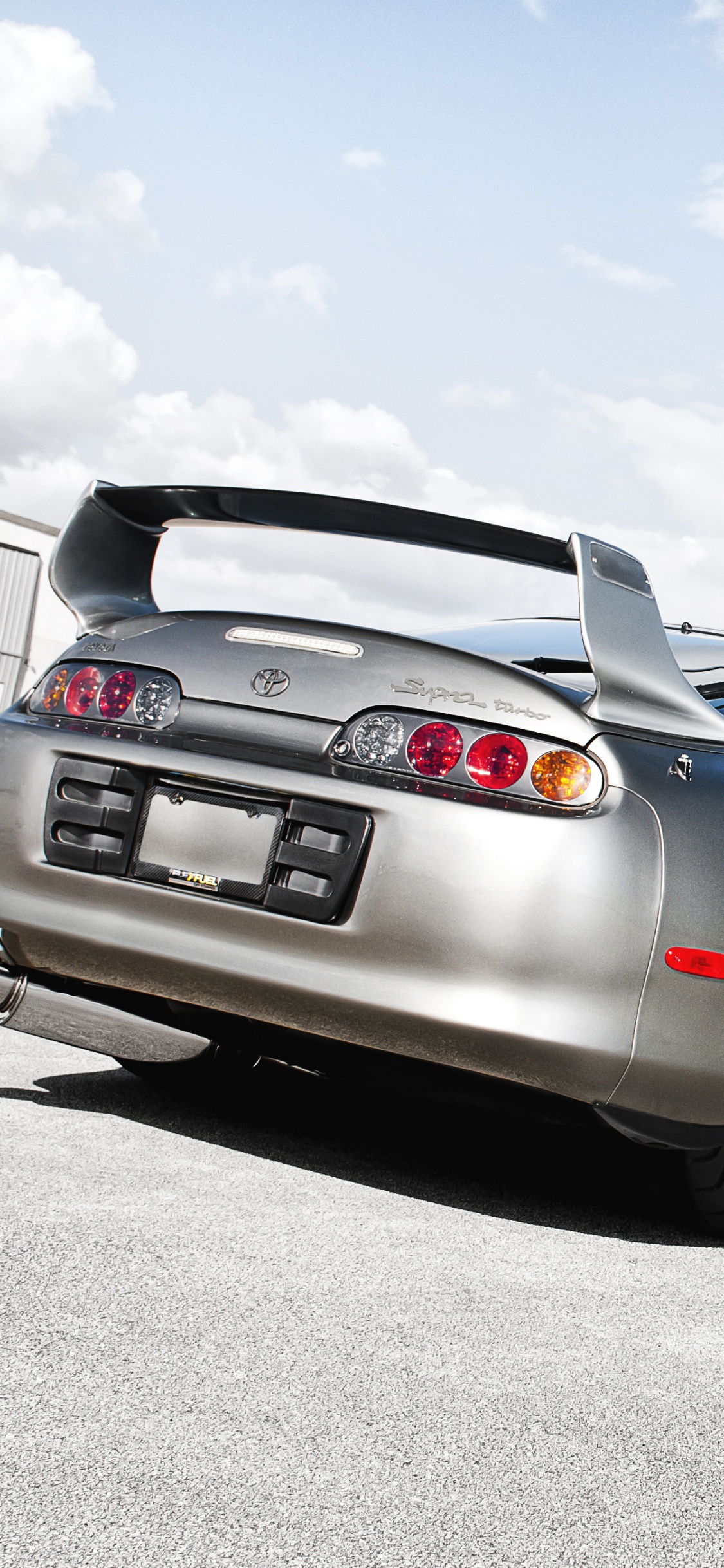 Silver Bmw Coupe on Gray Asphalt Road During Daytime. Wallpaper in 1125x2436 Resolution