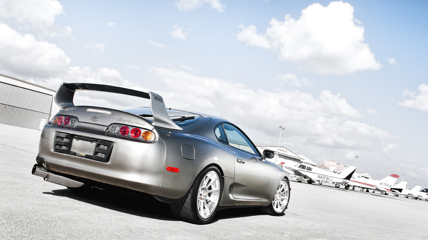 Silver Bmw Coupe on Gray Asphalt Road During Daytime. Wallpaper in 1366x768 Resolution