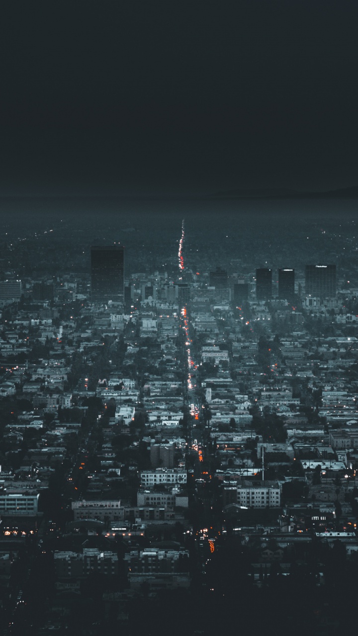 Vue Aérienne Des Bâtiments de la Ville Pendant la Nuit. Wallpaper in 720x1280 Resolution