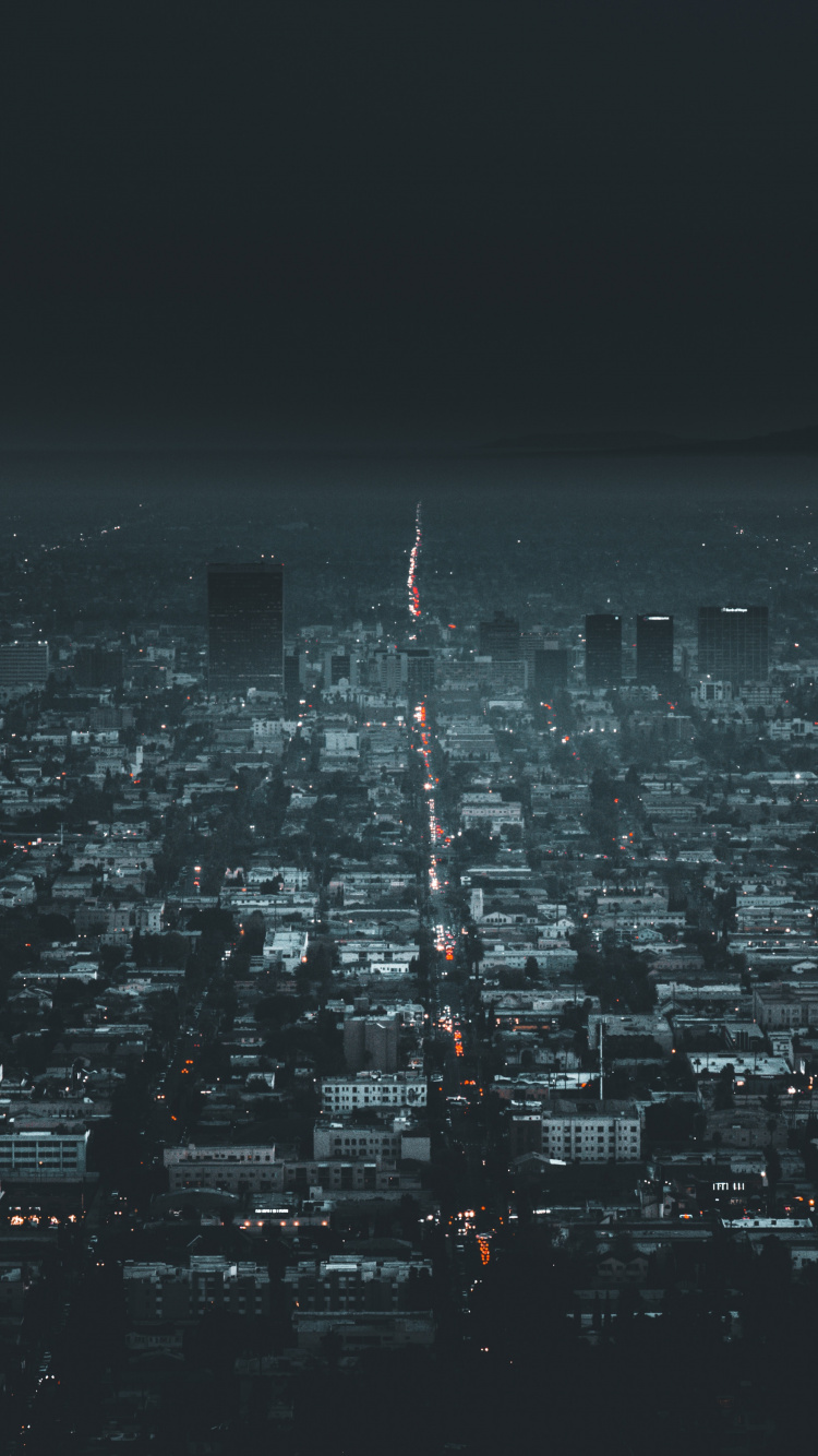 Vue Aérienne Des Bâtiments de la Ville Pendant la Nuit. Wallpaper in 750x1334 Resolution