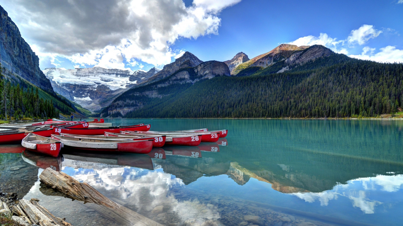 Red Boat on Lake Near Mountain Under Blue Sky During Daytime. Wallpaper in 1366x768 Resolution