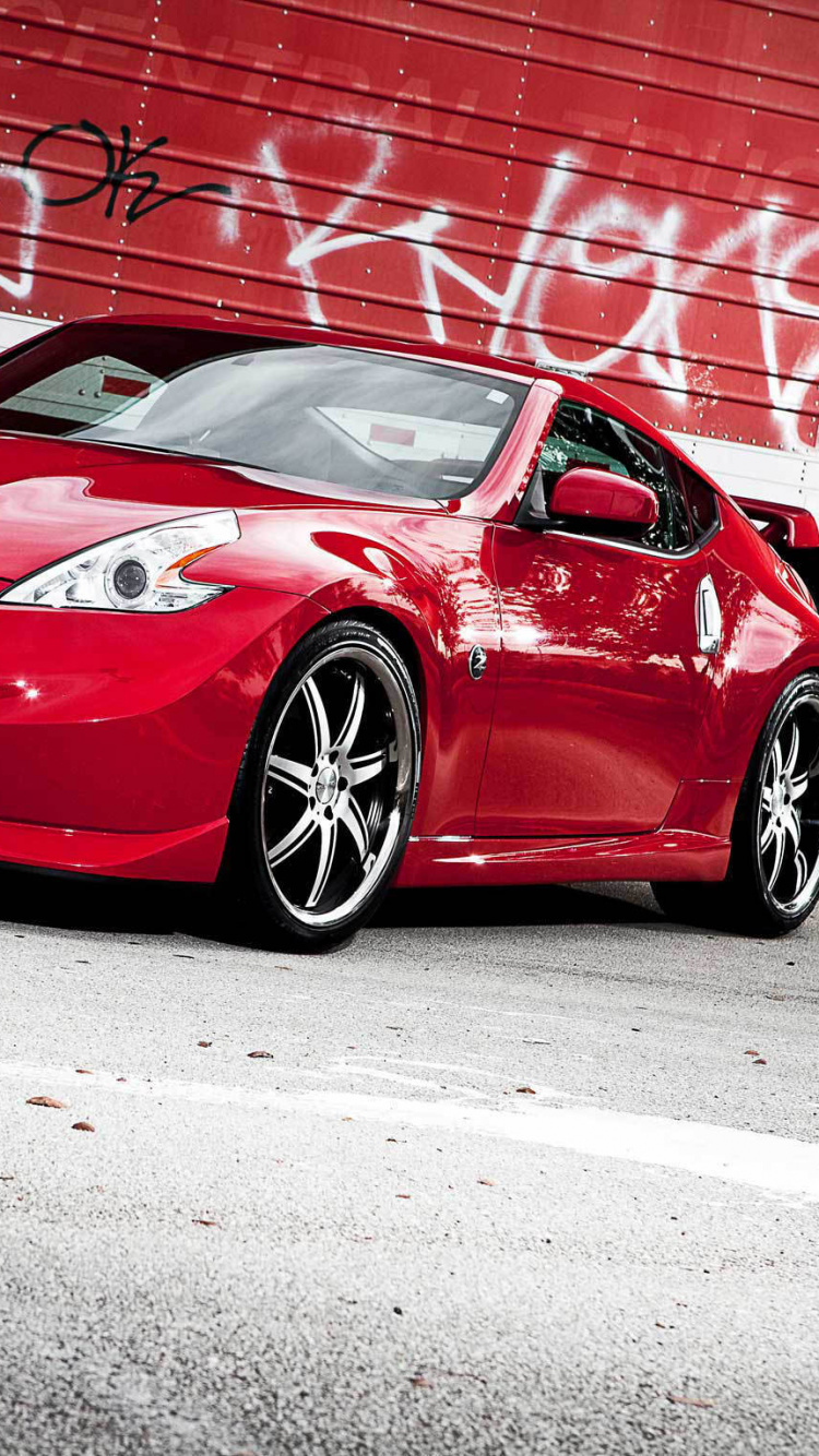 Ferrari 458 Italia Rojo Estacionado en el Estacionamiento Durante el Día. Wallpaper in 750x1334 Resolution