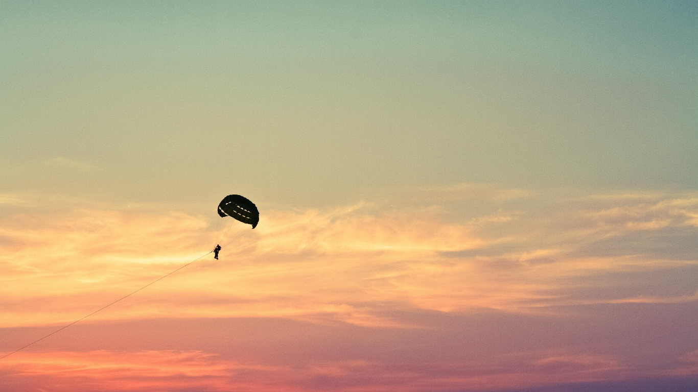 Person in Parachute Under Blue Sky During Daytime. Wallpaper in 1366x768 Resolution