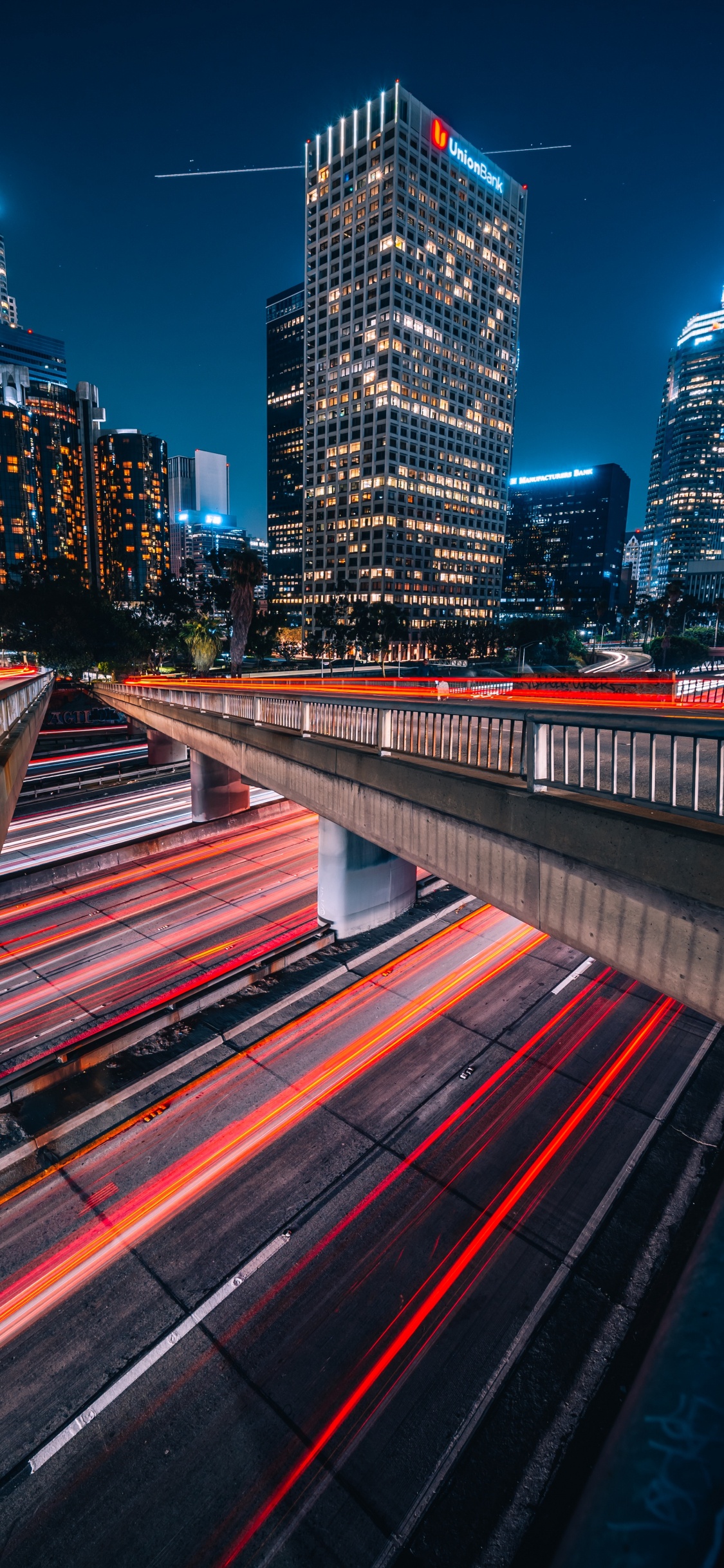 Time Lapse Photography of City Lights During Night Time. Wallpaper in 1125x2436 Resolution
