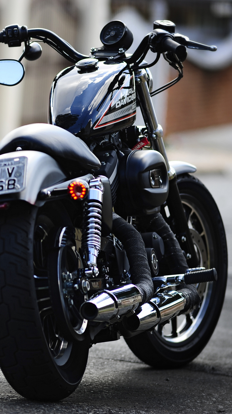 Black Cruiser Motorcycle on Road During Daytime. Wallpaper in 750x1334 Resolution