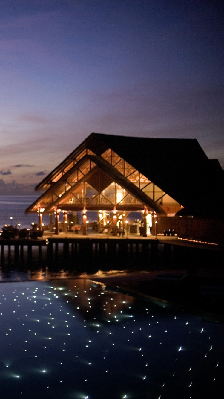 Brown Wooden House on Body of Water During Sunset. Wallpaper in 750x1334 Resolution