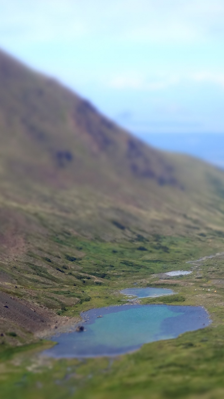 Green Mountains Near Lake Under White Clouds During Daytime. Wallpaper in 720x1280 Resolution