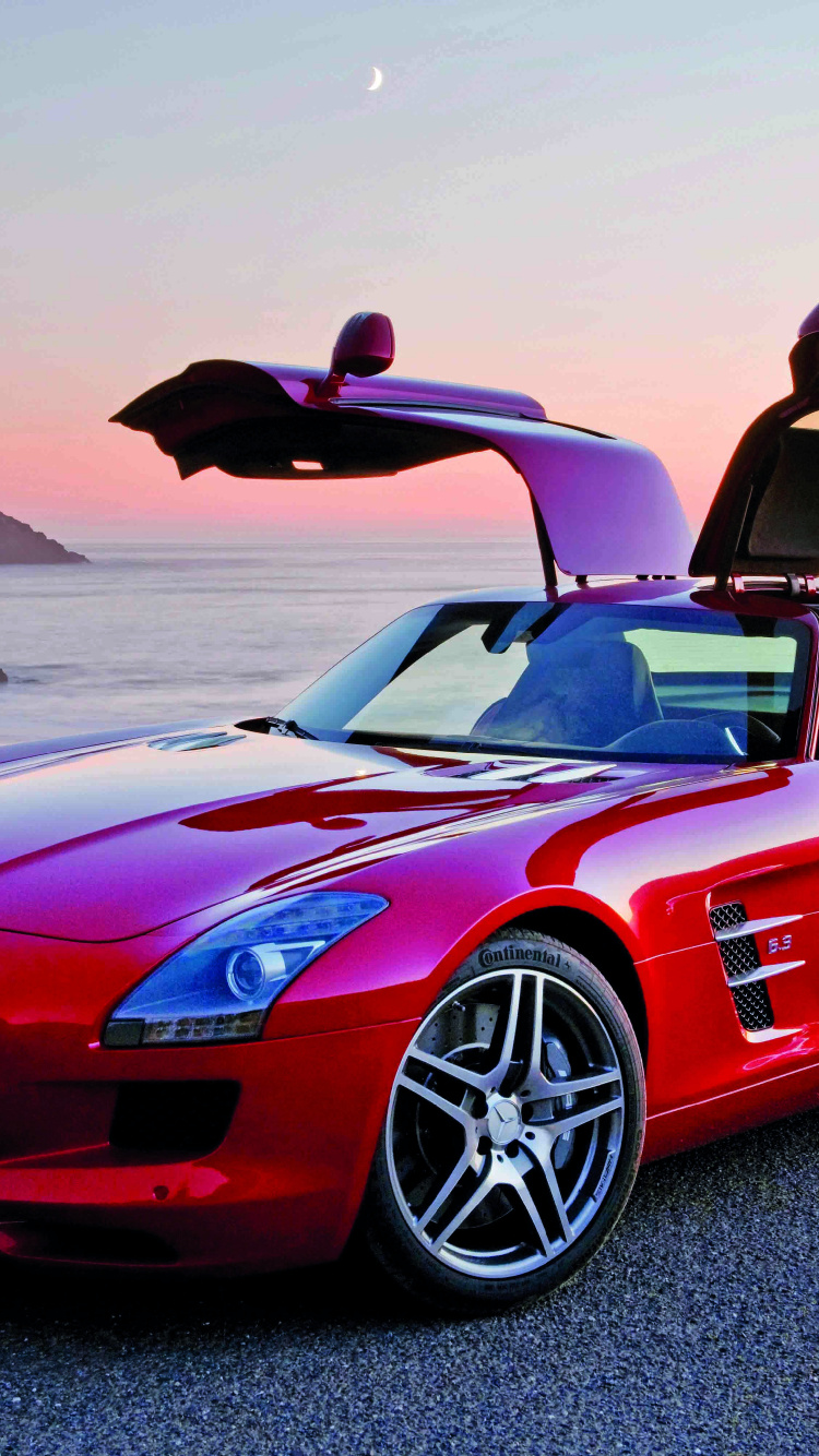 Red Ferrari 458 Italia on Gray Sand During Daytime. Wallpaper in 750x1334 Resolution