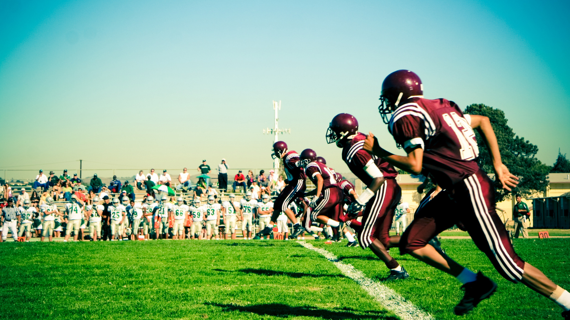 Football Players on Green Grass Field During Daytime. Wallpaper in 1920x1080 Resolution