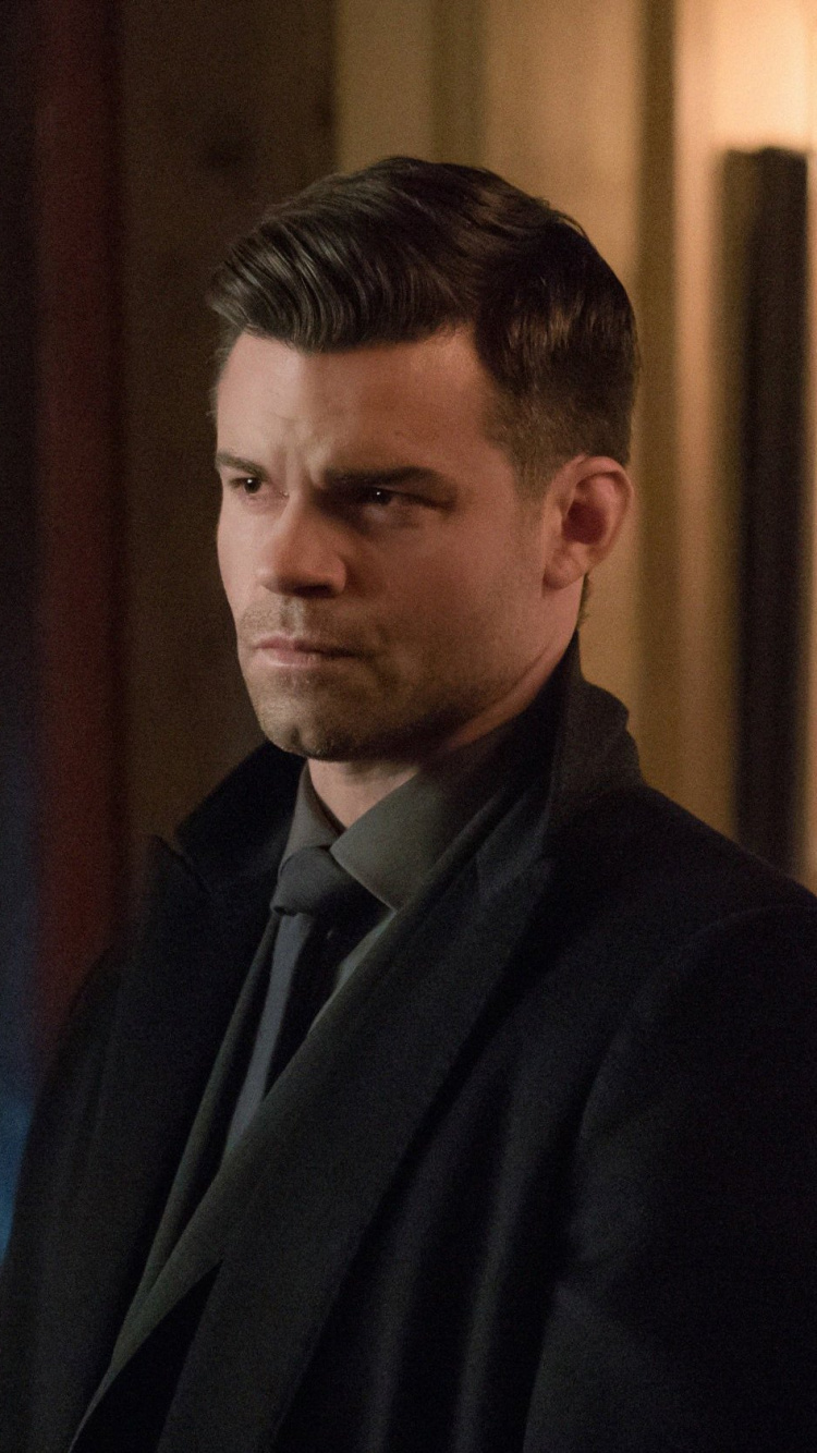 Man in Black Suit Jacket. Wallpaper in 750x1334 Resolution