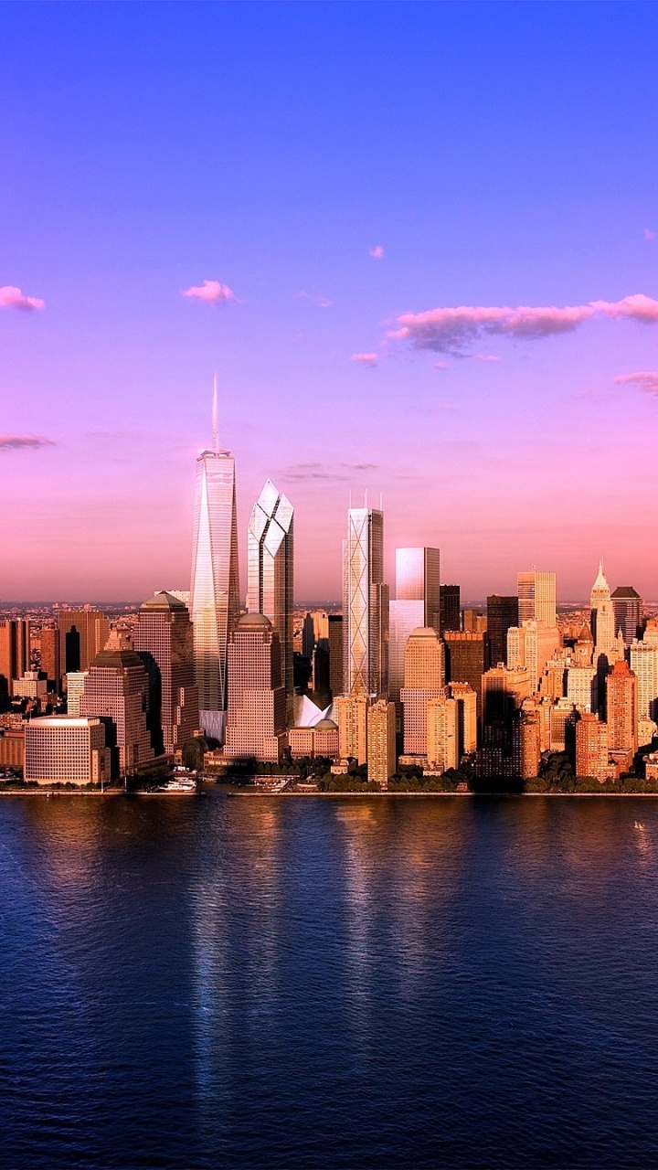 City Skyline Across Body of Water During Daytime. Wallpaper in 720x1280 Resolution