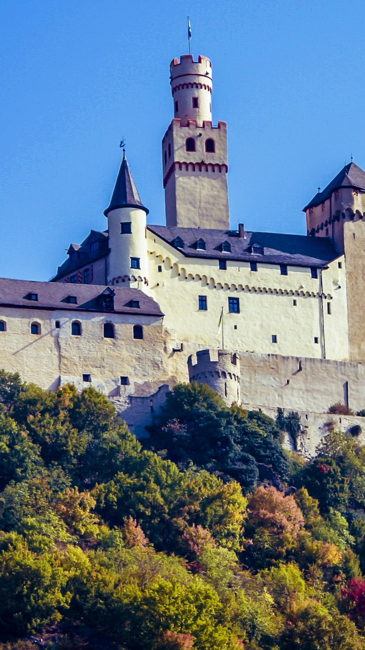 White and Gray Concrete Castle on Top of Green Mountain During Daytime. Wallpaper in 720x1280 Resolution