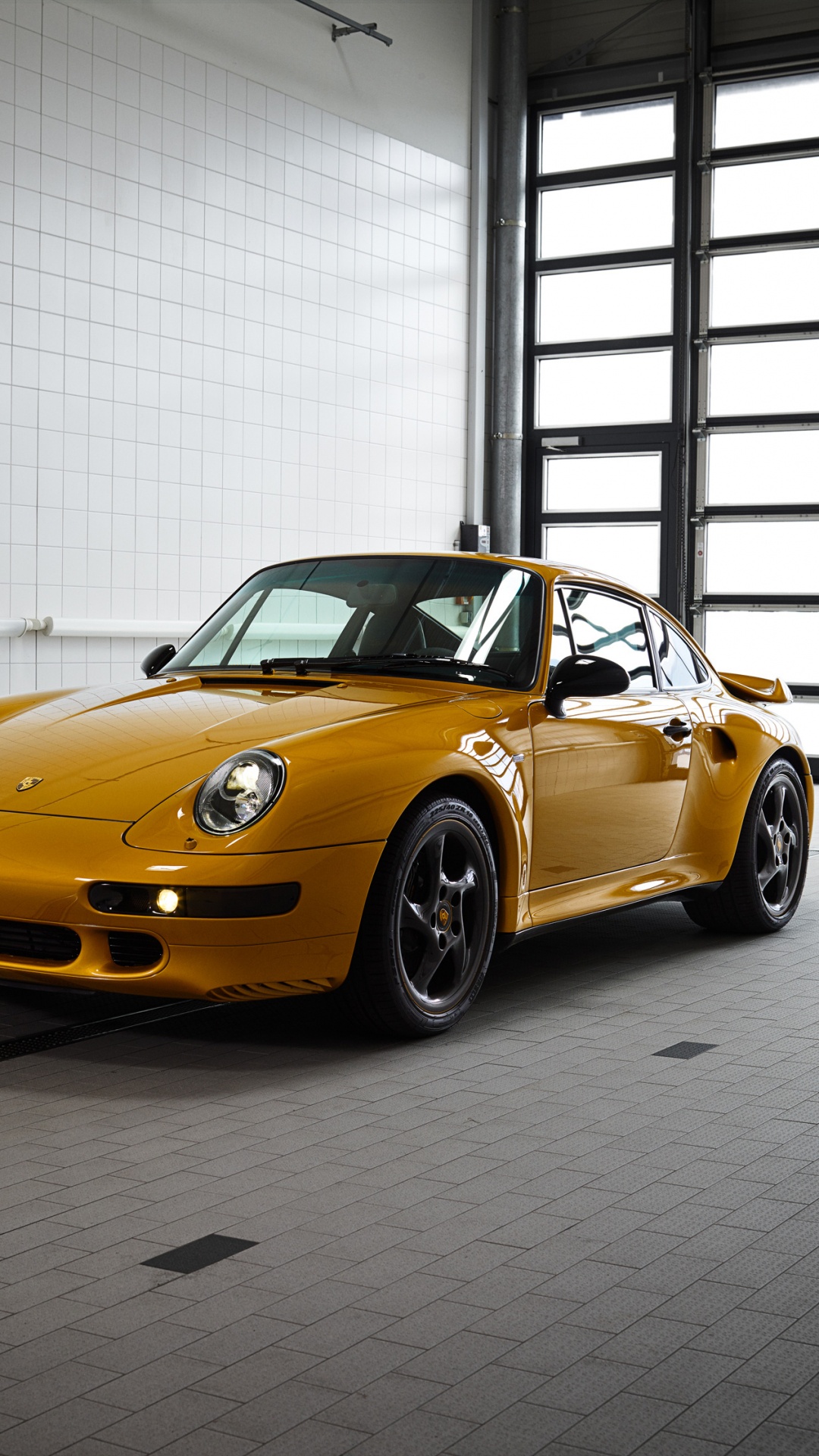 Yellow Porsche 911 Parked in Front of White Wall. Wallpaper in 1080x1920 Resolution