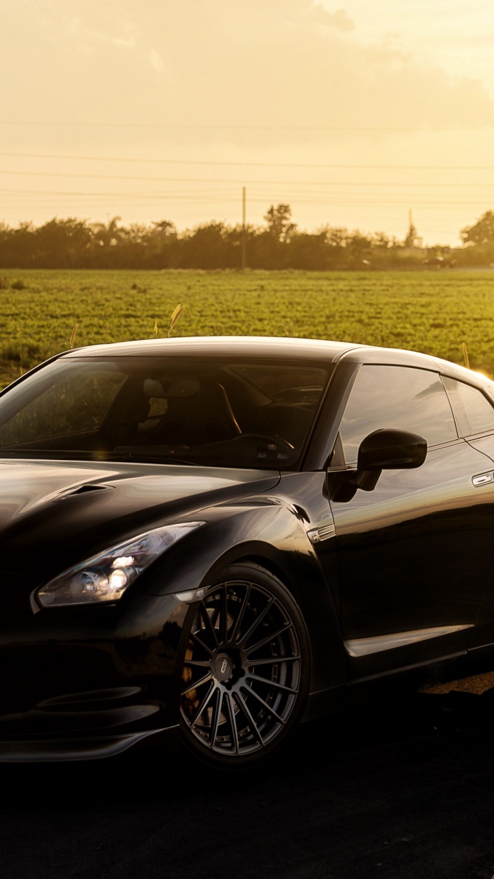Porsche 911 Noire Sur Route Pendant la Journée. Wallpaper in 720x1280 Resolution