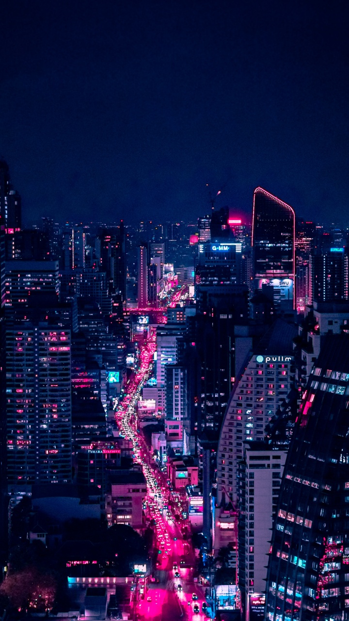 City With High Rise Buildings During Night Time. Wallpaper in 720x1280 Resolution