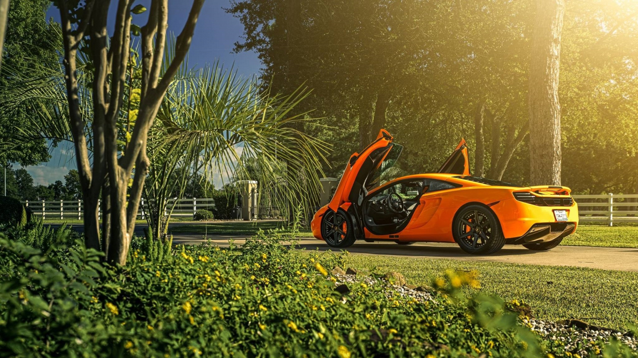 Orange Ferrari Car on Road During Daytime. Wallpaper in 1280x720 Resolution