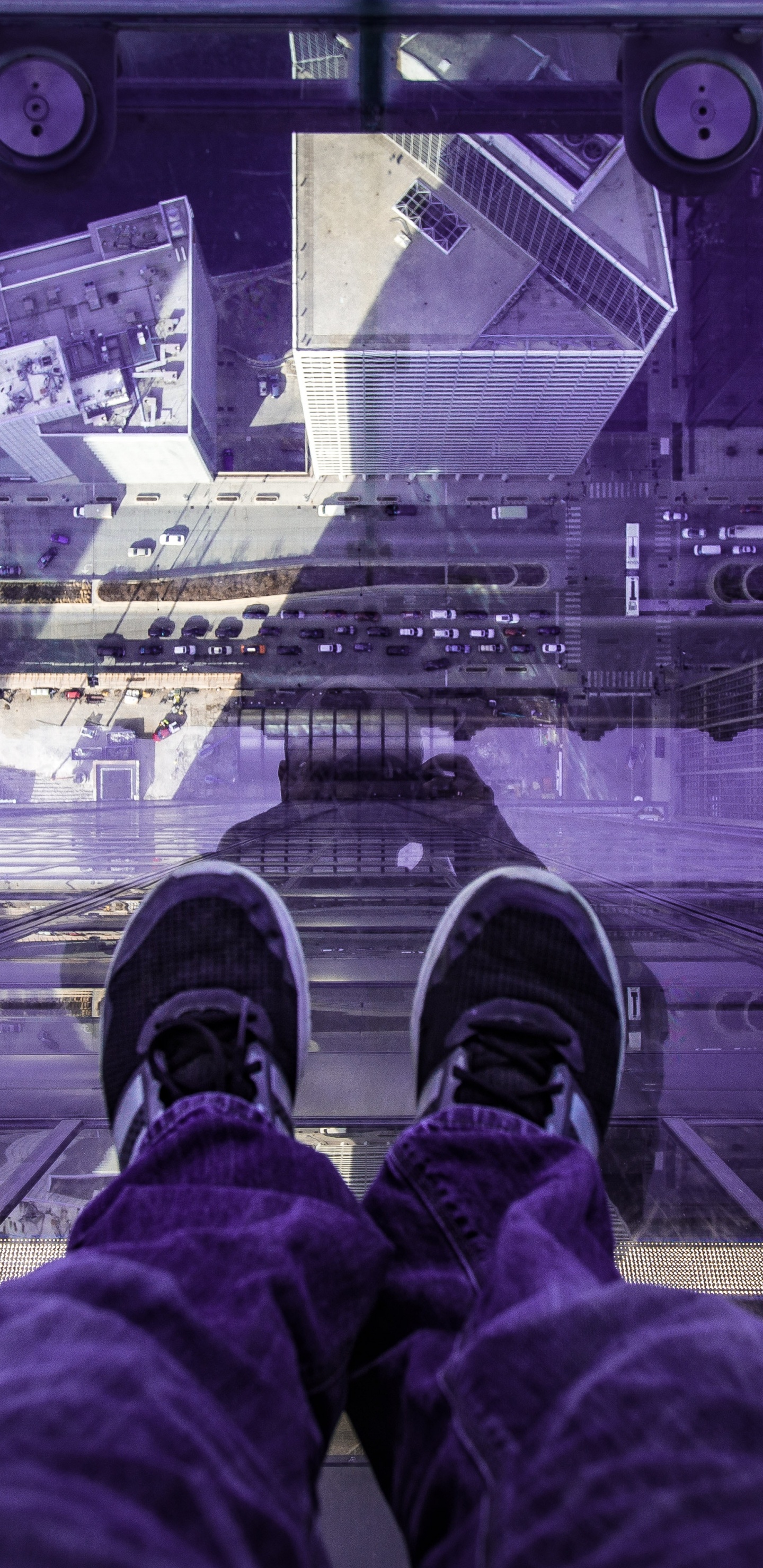 Person in Red Pants and Black Shoes Sitting on The Edge of a Building. Wallpaper in 1440x2960 Resolution
