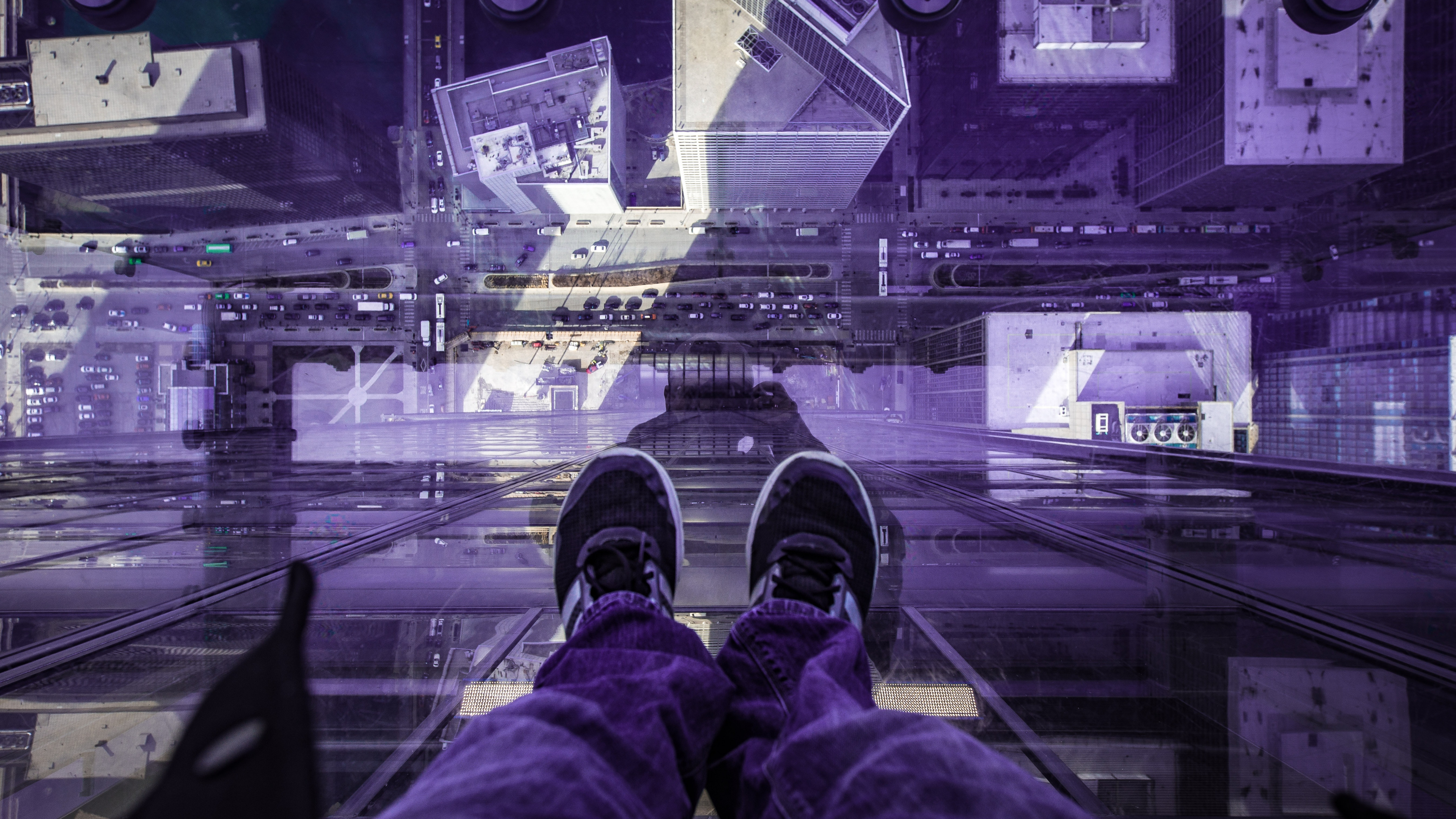 Person in Red Pants and Black Shoes Sitting on The Edge of a Building. Wallpaper in 3840x2160 Resolution