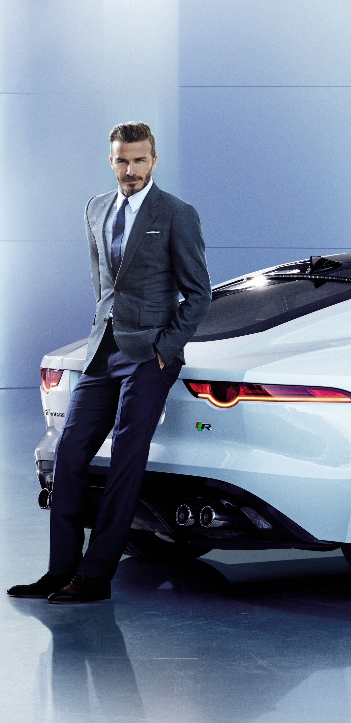 Man in Black Suit Standing Beside White Porsche 911 Coupe. Wallpaper in 1440x2960 Resolution