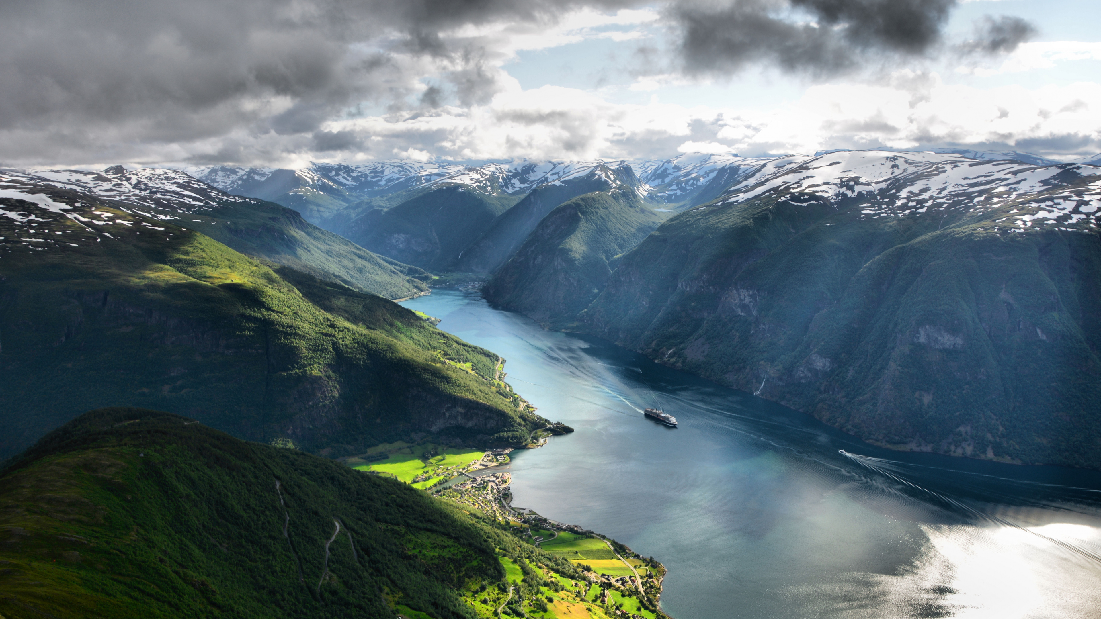 Green Mountains Near Body of Water Under White Clouds During Daytime. Wallpaper in 3840x2160 Resolution