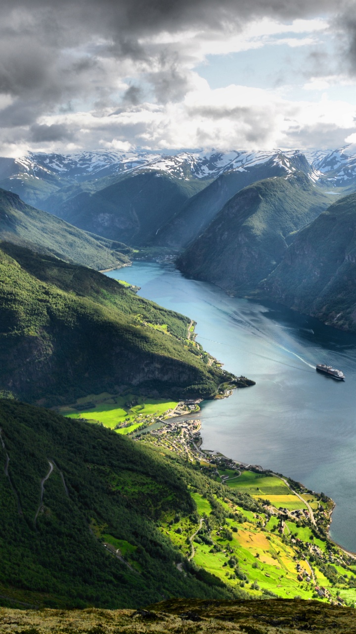 Green Mountains Near Body of Water Under White Clouds During Daytime. Wallpaper in 720x1280 Resolution