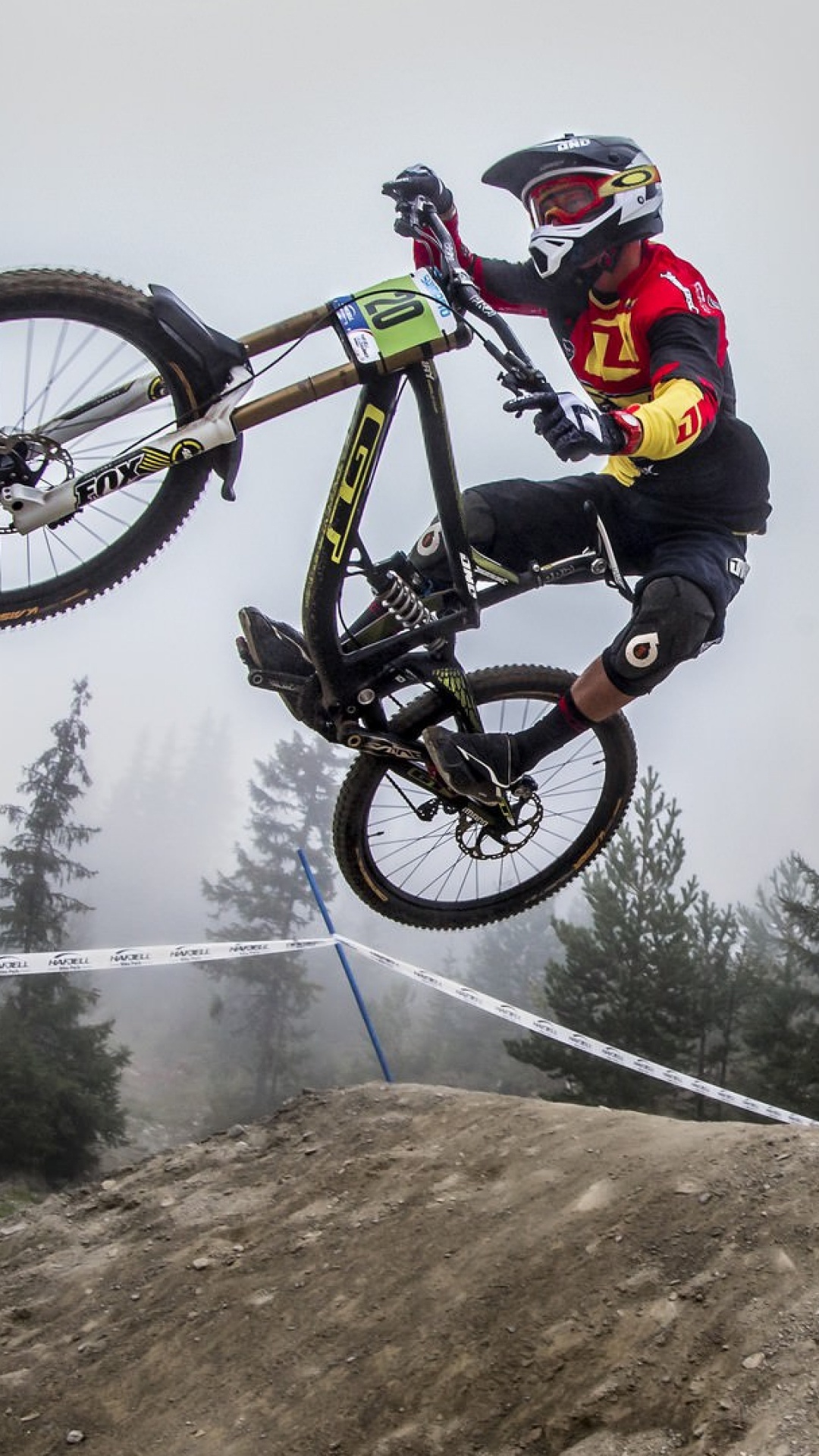 Man in Black Jacket Riding on White and Black Mountain Bike. Wallpaper in 1080x1920 Resolution
