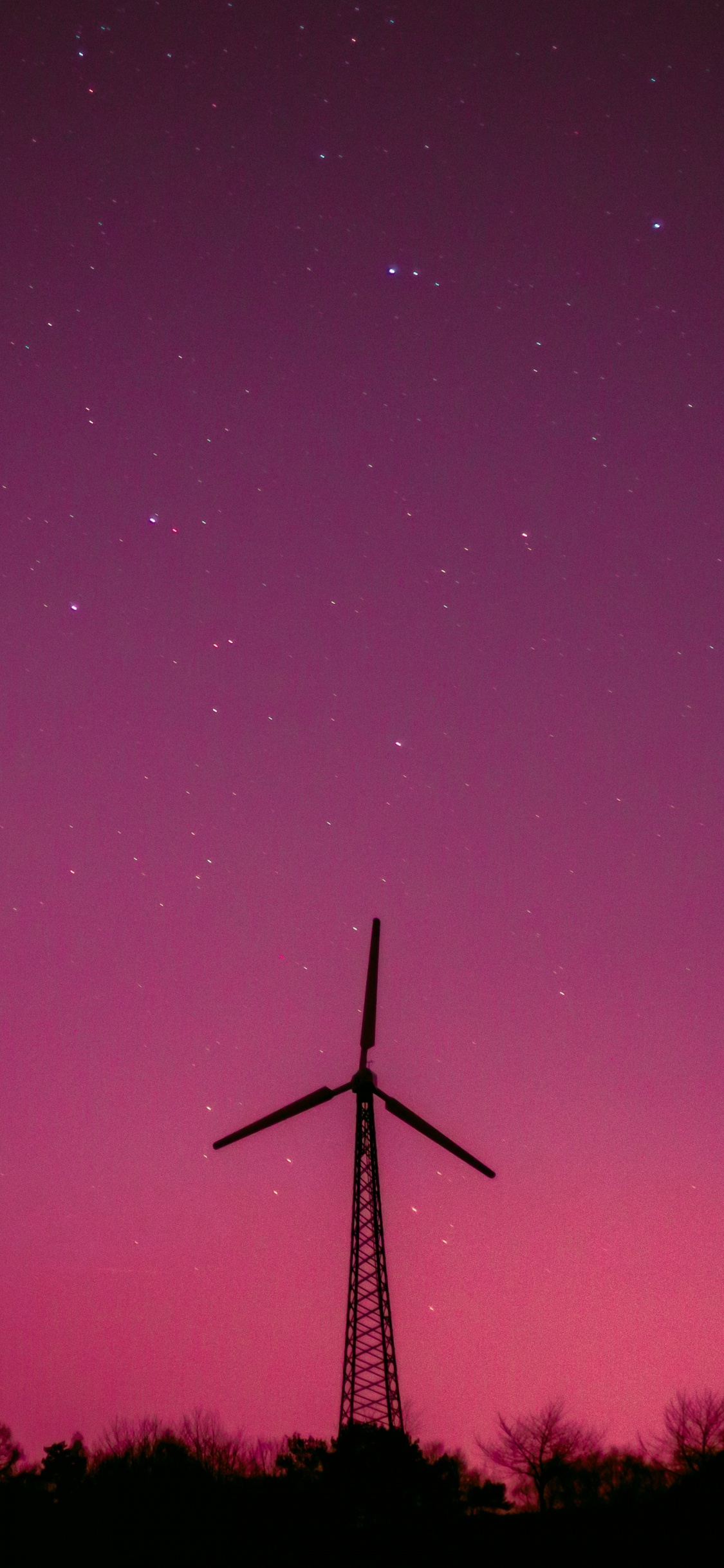 Silhouette Der Windmühle Unter Lila Himmel. Wallpaper in 1125x2436 Resolution