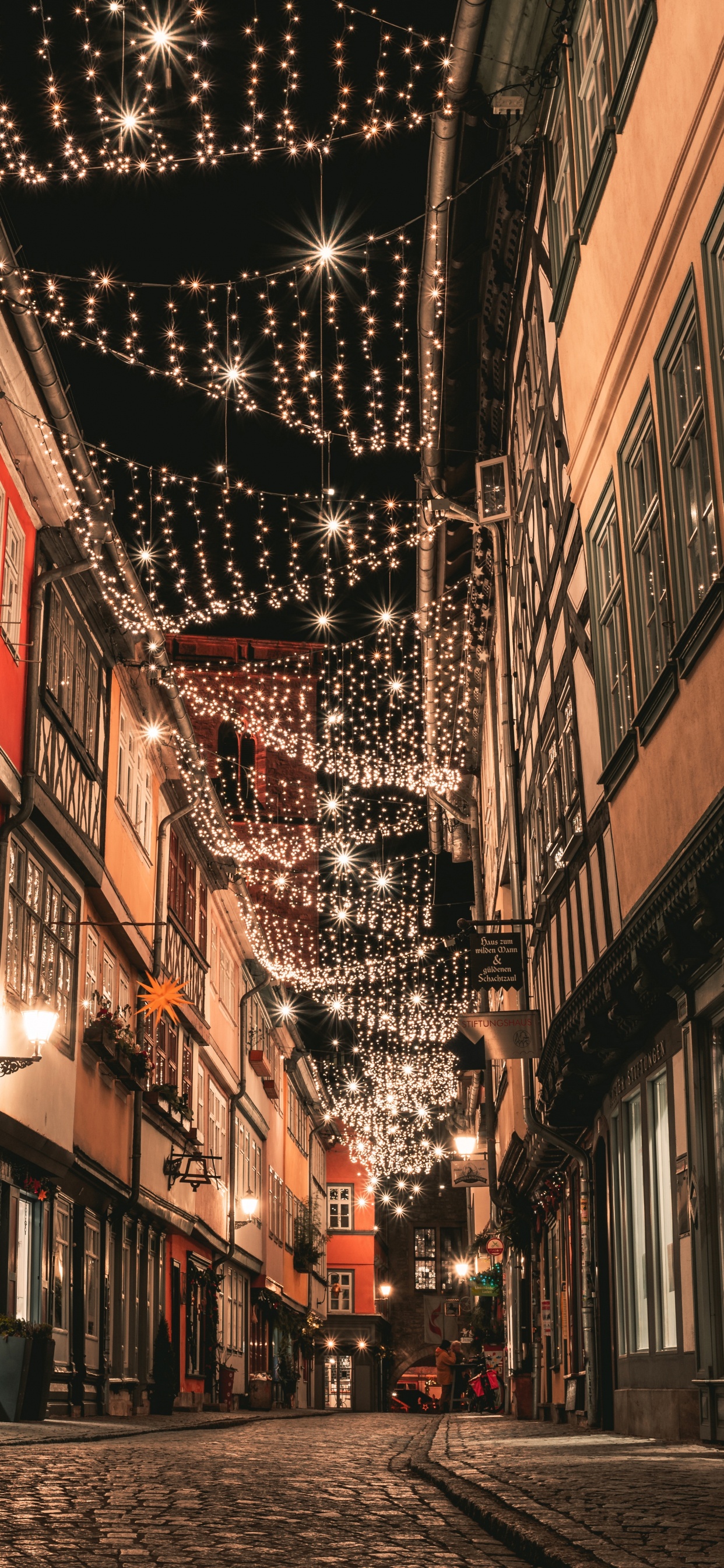 People Walking on Street Between Buildings During Daytime. Wallpaper in 1242x2688 Resolution