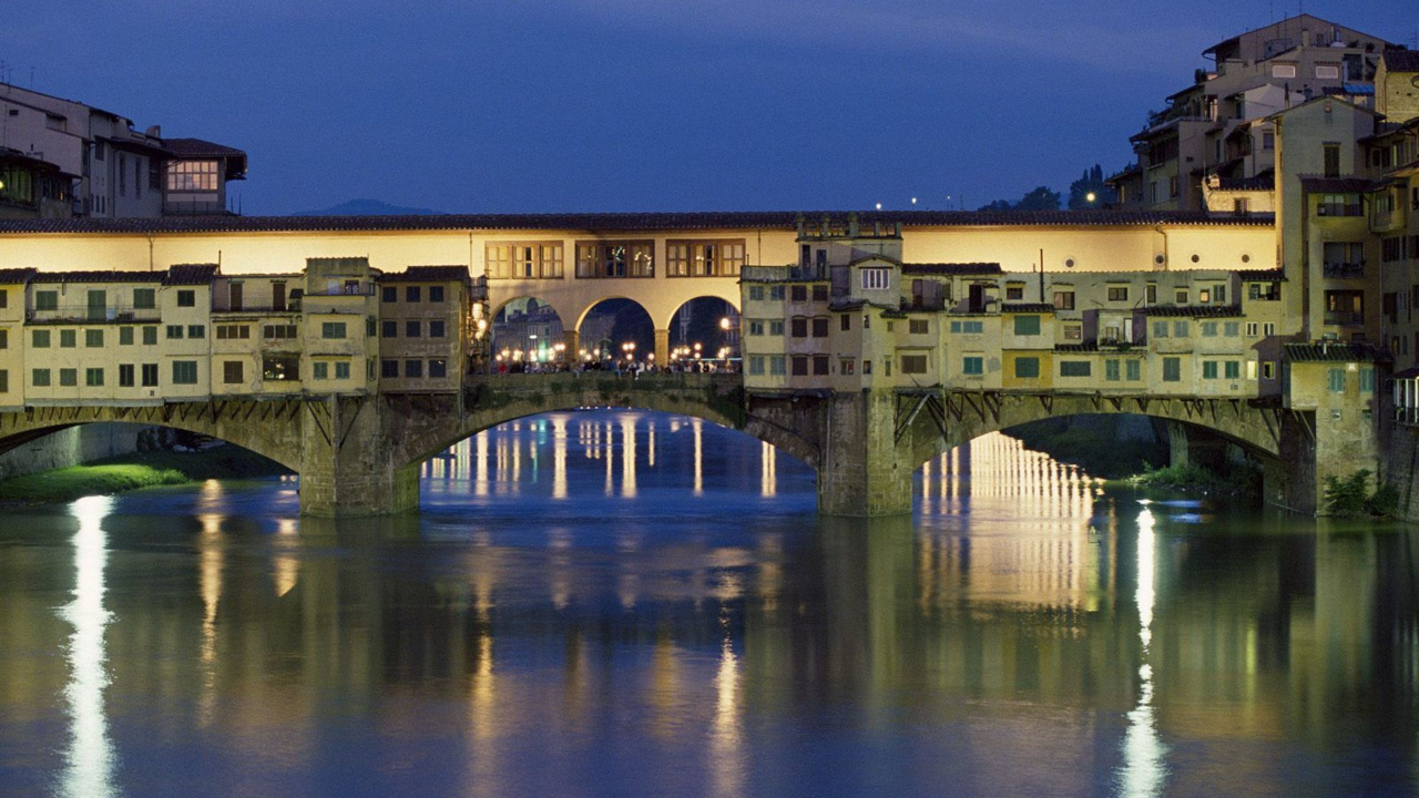 Brown Concrete Bridge Over River During Night Time. Wallpaper in 1280x720 Resolution