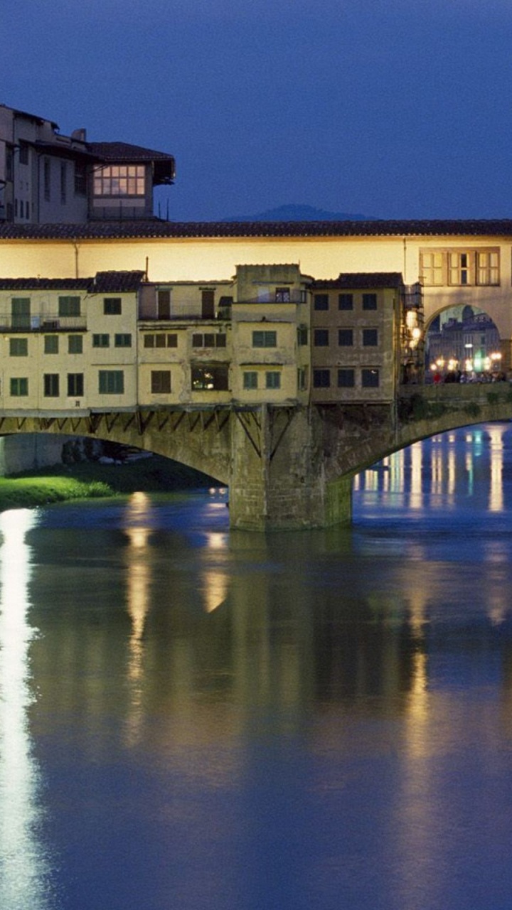 Brown Concrete Bridge Over River During Night Time. Wallpaper in 720x1280 Resolution