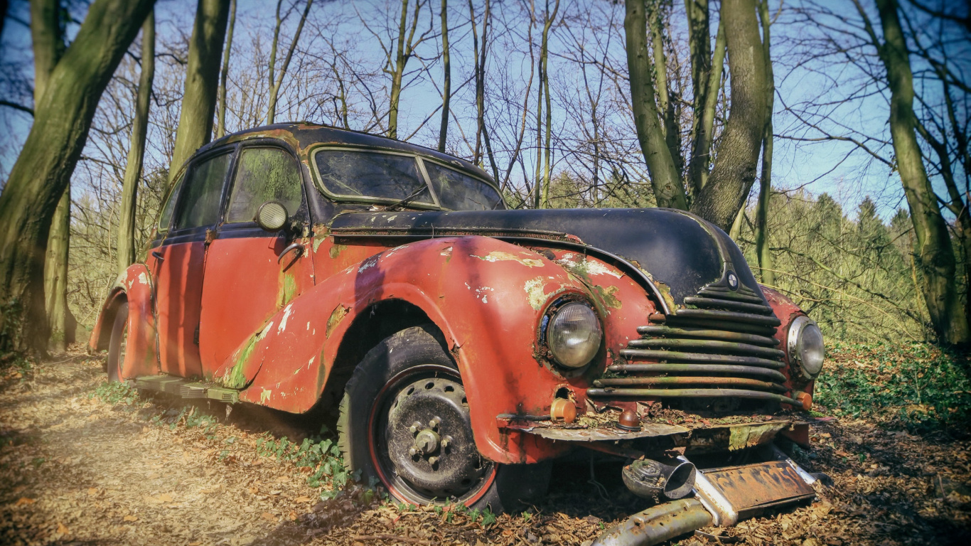 Red and Black Vintage Car Parked on Brown Grass Field During Daytime. Wallpaper in 1366x768 Resolution