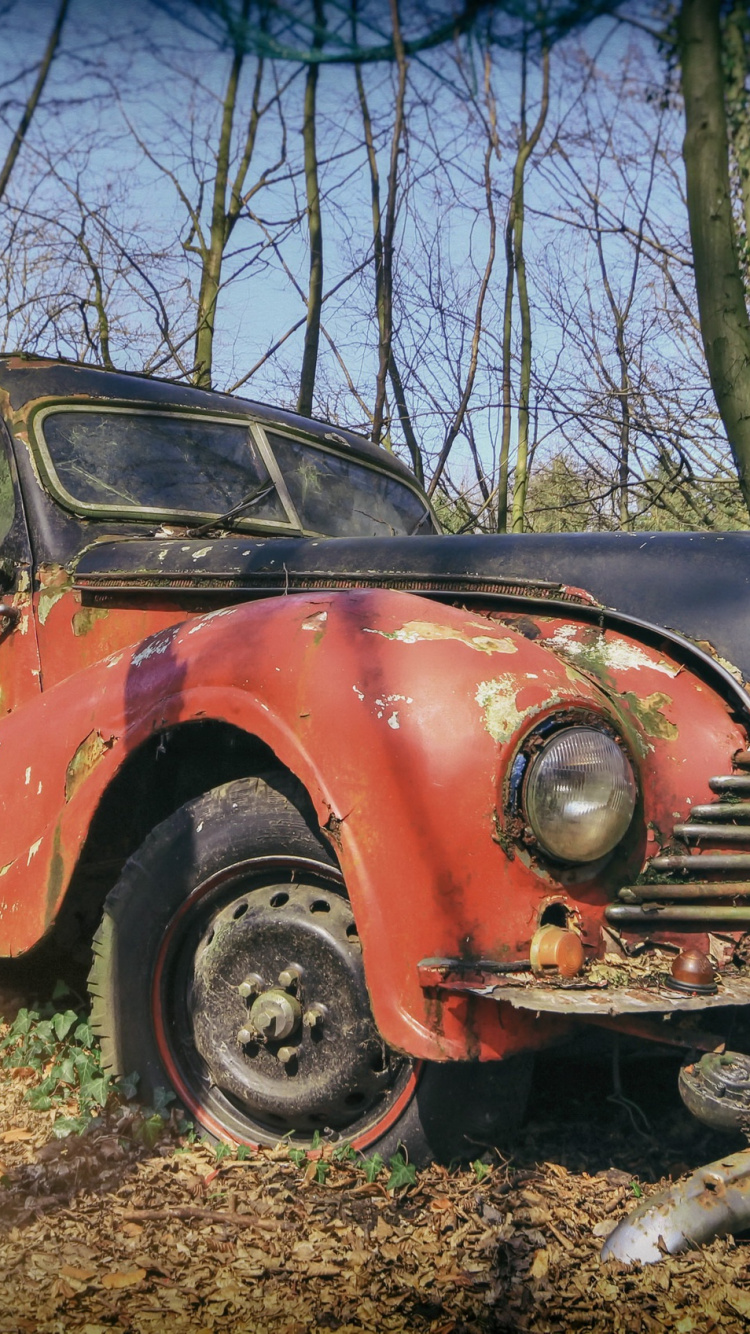 Red and Black Vintage Car Parked on Brown Grass Field During Daytime. Wallpaper in 750x1334 Resolution