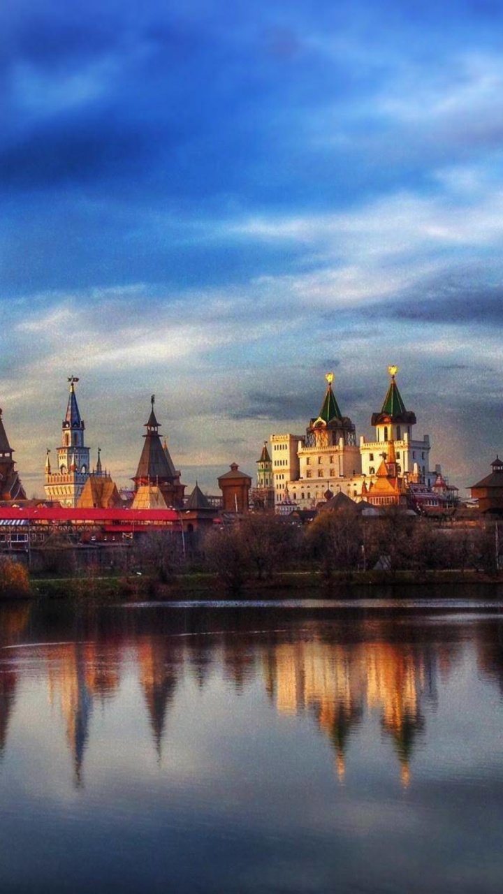 Brown and White Castle Near Body of Water Under Cloudy Sky During Daytime. Wallpaper in 720x1280 Resolution