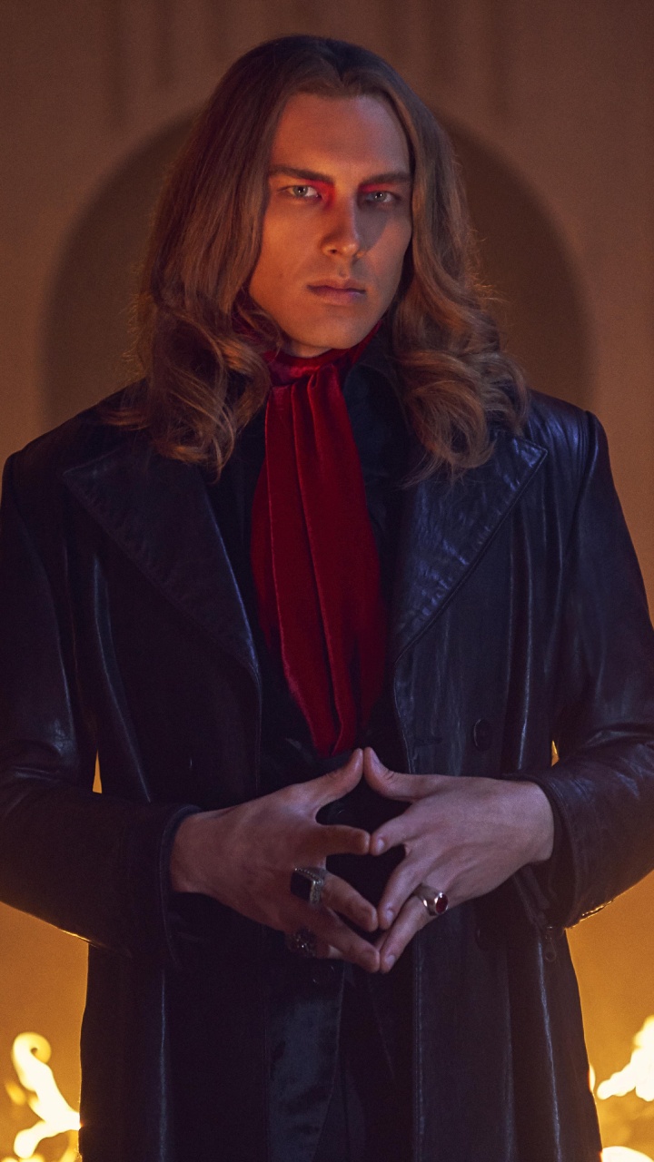 Woman in Black Coat Holding Lighted Candle. Wallpaper in 720x1280 Resolution