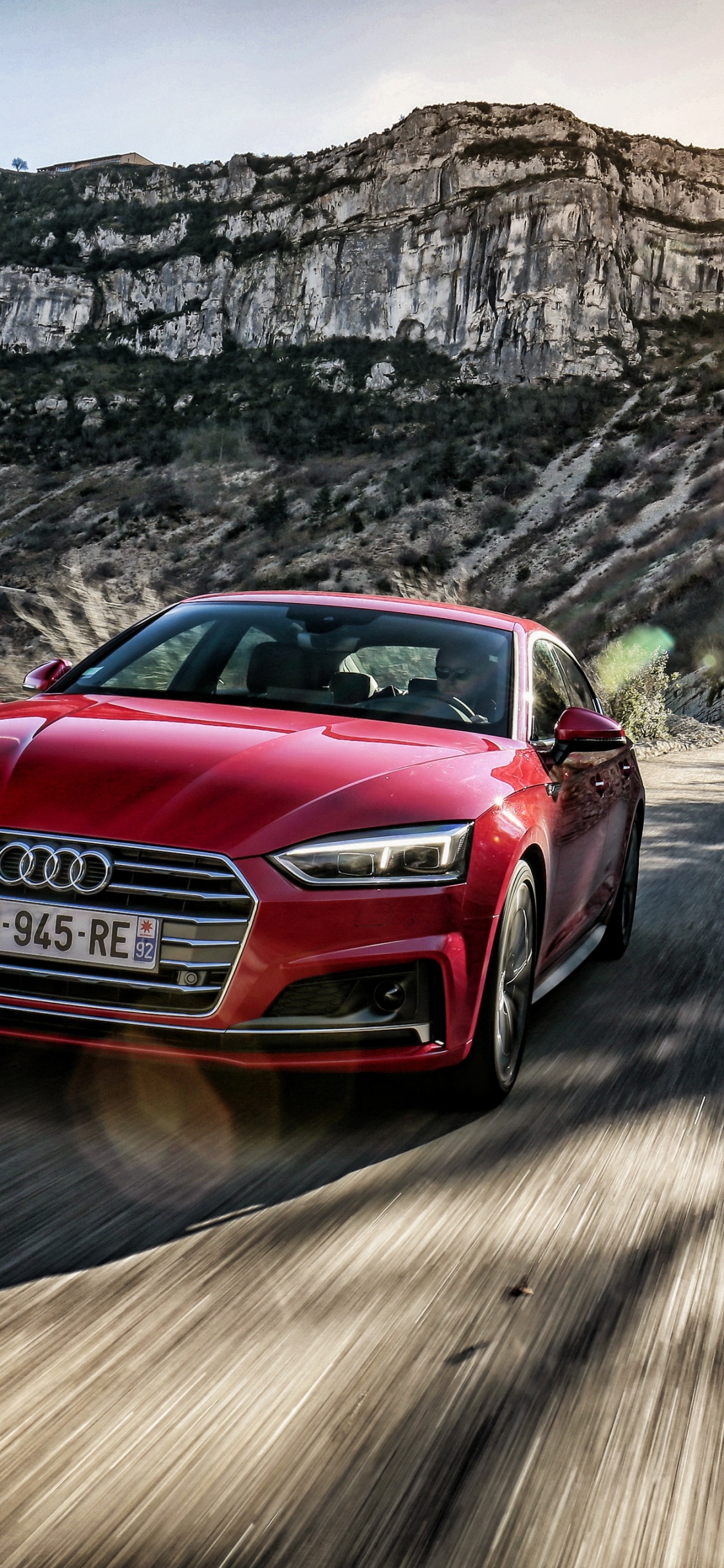 Red Audi a 4 on Road During Daytime. Wallpaper in 1125x2436 Resolution