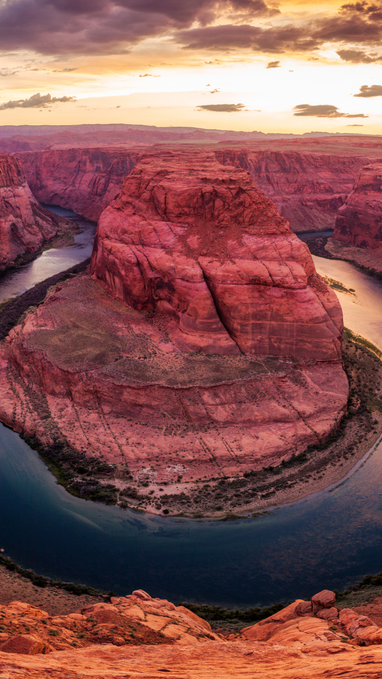 Brown Rock Formation Near Body of Water During Daytime. Wallpaper in 750x1334 Resolution