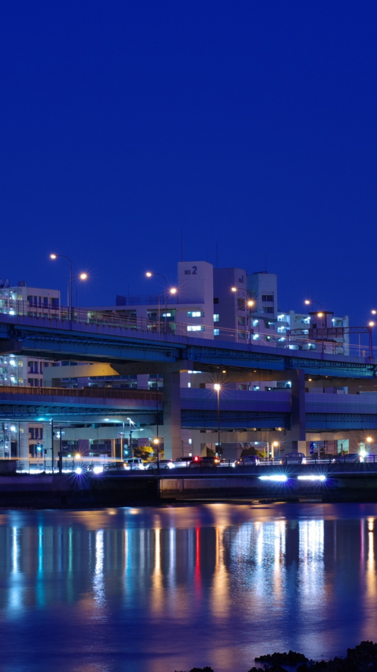 City Lights Turned on During Night Time. Wallpaper in 750x1334 Resolution